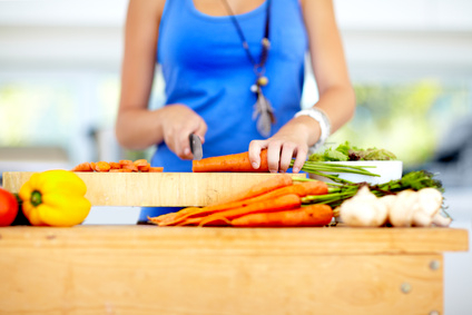 Taking care when chopping her veggies
